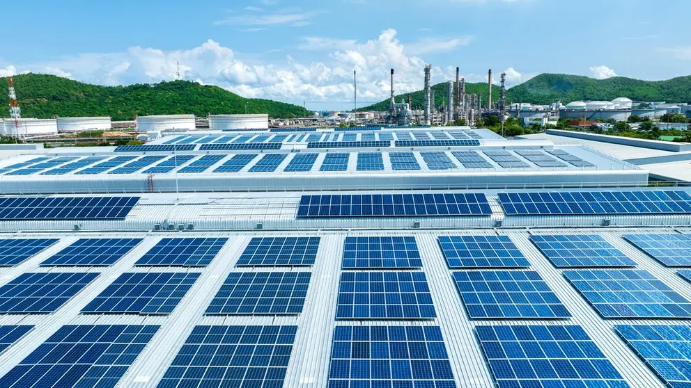 Top view Solar Cell on Warehouse Factory. Solor photo voltaic panels system power or Solar Cell on industrial building roof for producing green ecological electricity. Production of renewable energy.